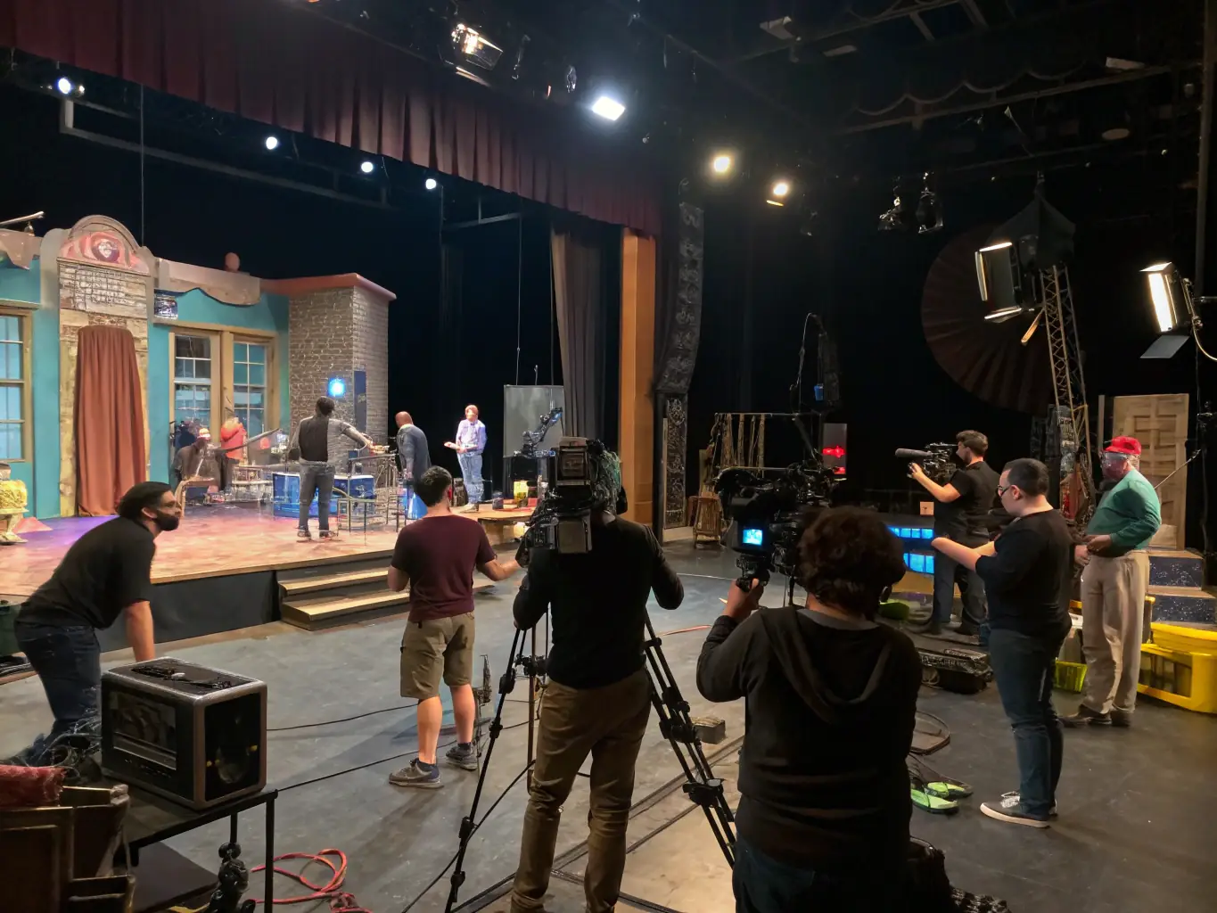 A vibrant image of a theater workshop in progress, with participants actively engaged in a scene rehearsal, showcasing the dynamic and collaborative environment of ARC EN SCENE's theater program.